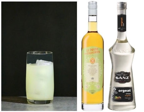 Mauresque Cocktail im Glas neben Pastis du Liquoriste und SANZ Orgeat Sirup