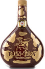 Flasche Tolón-Tolón Chocolate Cream Likör mit Haselnuss und Vanille, 70 cl, braun-goldenes Design mit Kuhmotiv und Glocke am Flaschenhals.