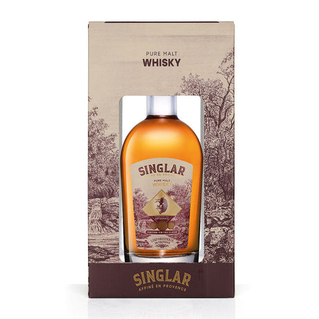 Singlar Pure Malt Whisky in Geschenkbox aus der Provence, Frankreich. Die Flasche zeigt einen goldenen Whisky, gereift in französischen Weinfässern.